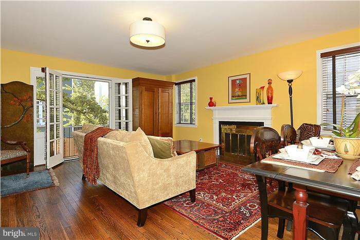 1208 Portner Road Alexandria, VA 22314 - Photo 7 of 30 a living room with furniture rug and a fireplace
