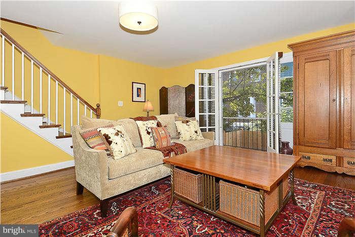 1208 Portner Road Alexandria, VA 22314 - Photo 9 of 30 a living room with furniture a rug and a large window