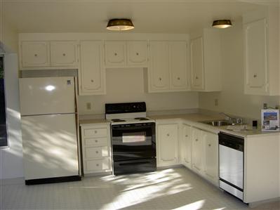 2829 Yuma Court Santa Rosa, CA 95403 - Photo 6 of 7 a kitchen with granite countertop white cabinets and stainless steel appliances
