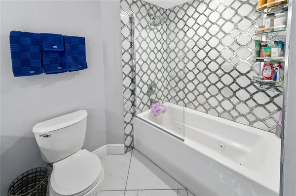 a bathroom with a toilet and a sink