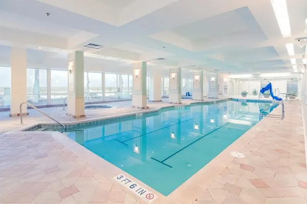 a bathroom with a sink mirror and a bath tub
