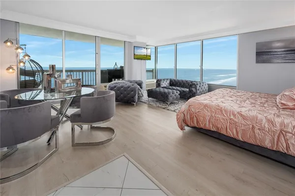 a bedroom with two beds and a couch