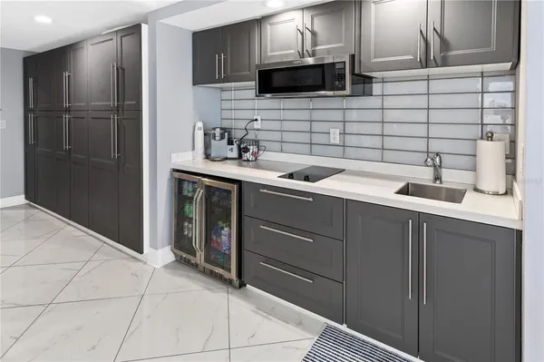 a kitchen with a sink and cabinets