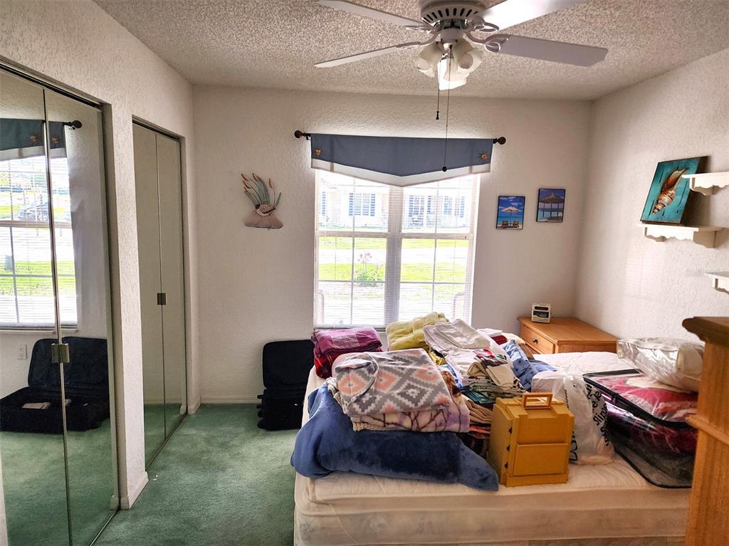 11660 Southwest 89th Terrace Ocala, FL 34481 - Photo 8 of 16 a bedroom with bed and window