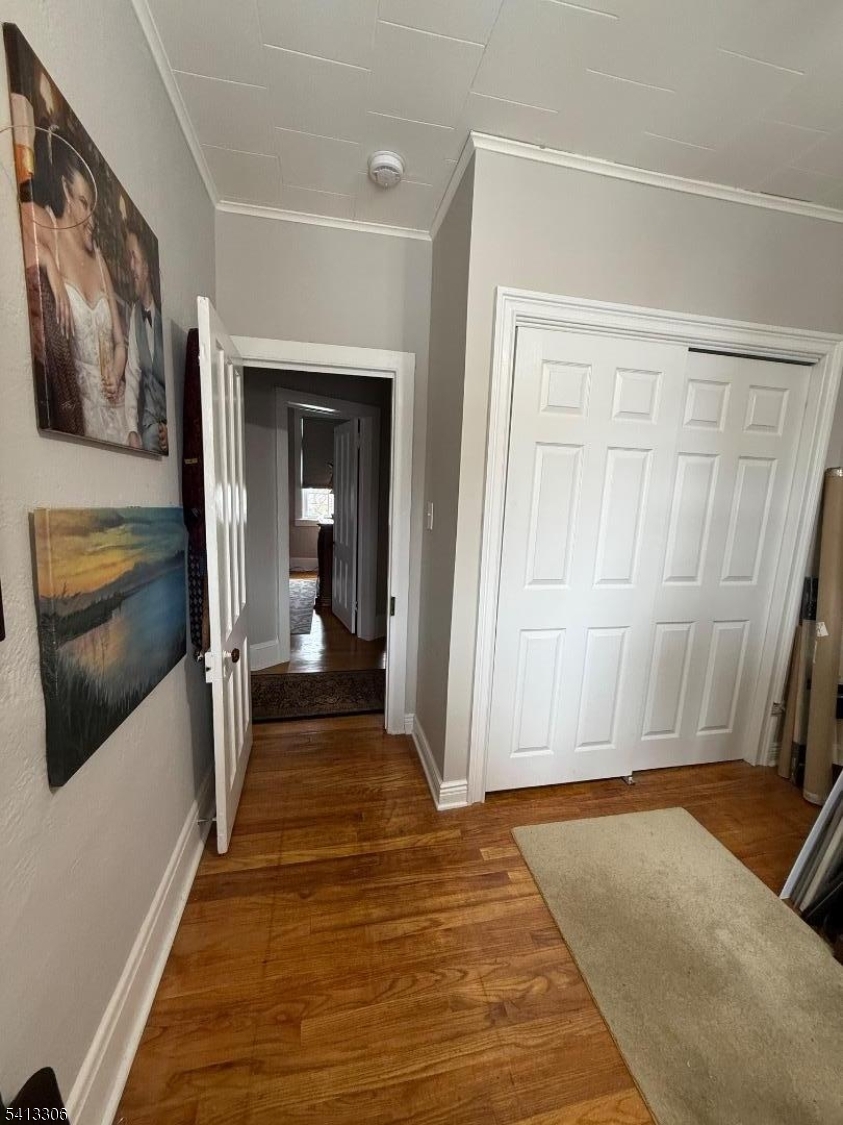 69 2nd Avenue Raritan, NJ 08869 - Photo 12 of 12 a view of a hallway with wooden floor and staircase