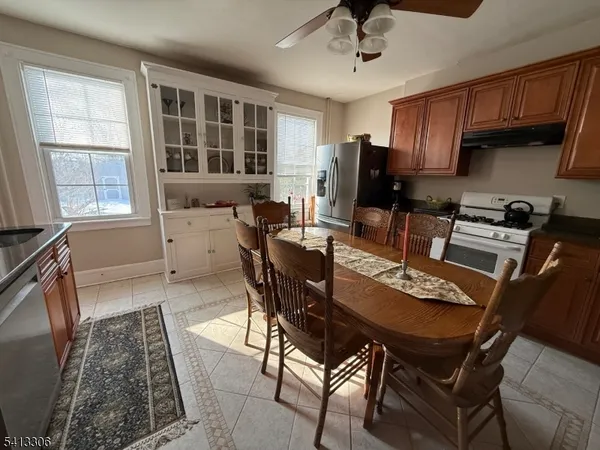 a dining room with furniture and window