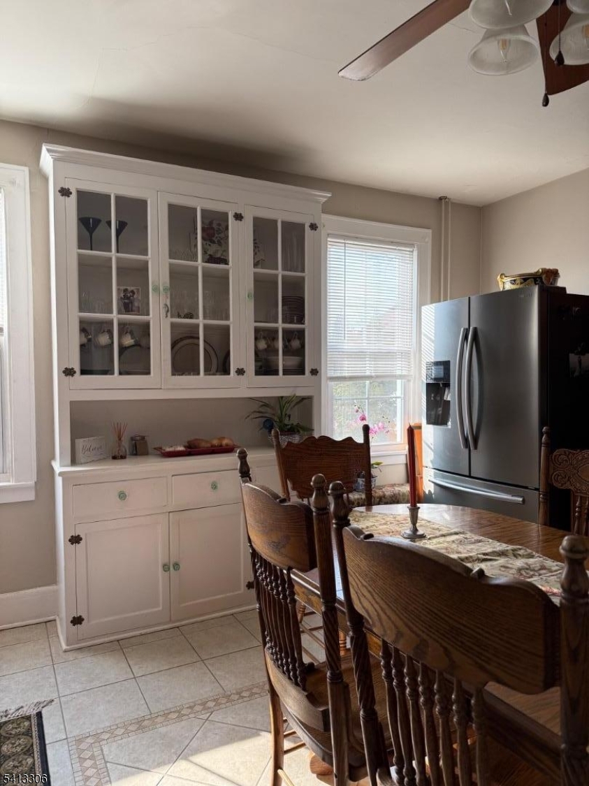 69 2nd Avenue Raritan, NJ 08869 - Photo 6 of 12 a kitchen with a table chairs refrigerator and cabinets