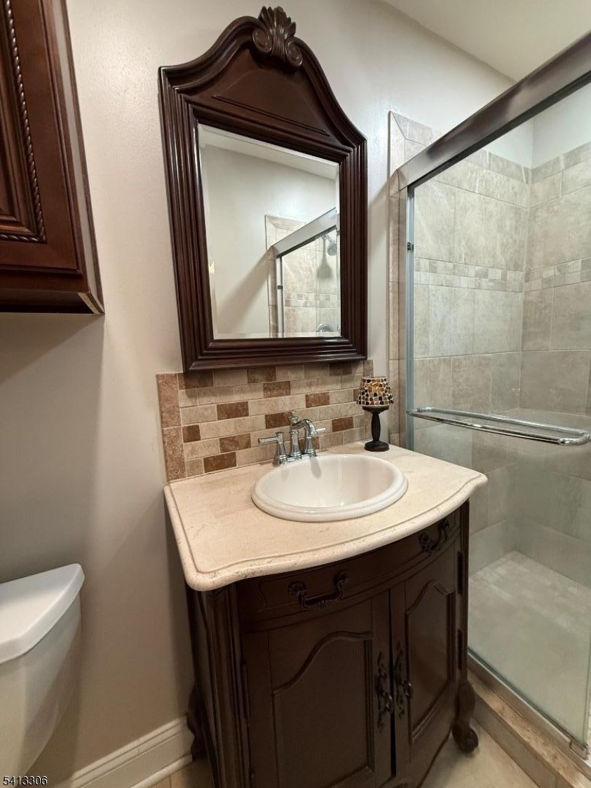 69 2nd Avenue Raritan, NJ 08869 - Photo 7 of 12 a bathroom with a sink vanity and toilet