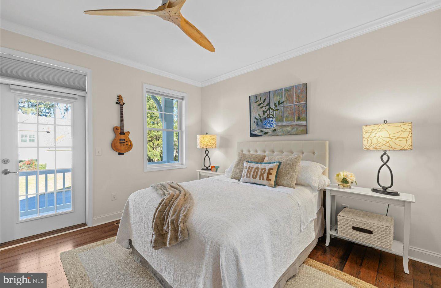 23280 Horse Island Road Lewes, DE 19958 - Photo 21 of 71 a bedroom with a bed and wooden floor