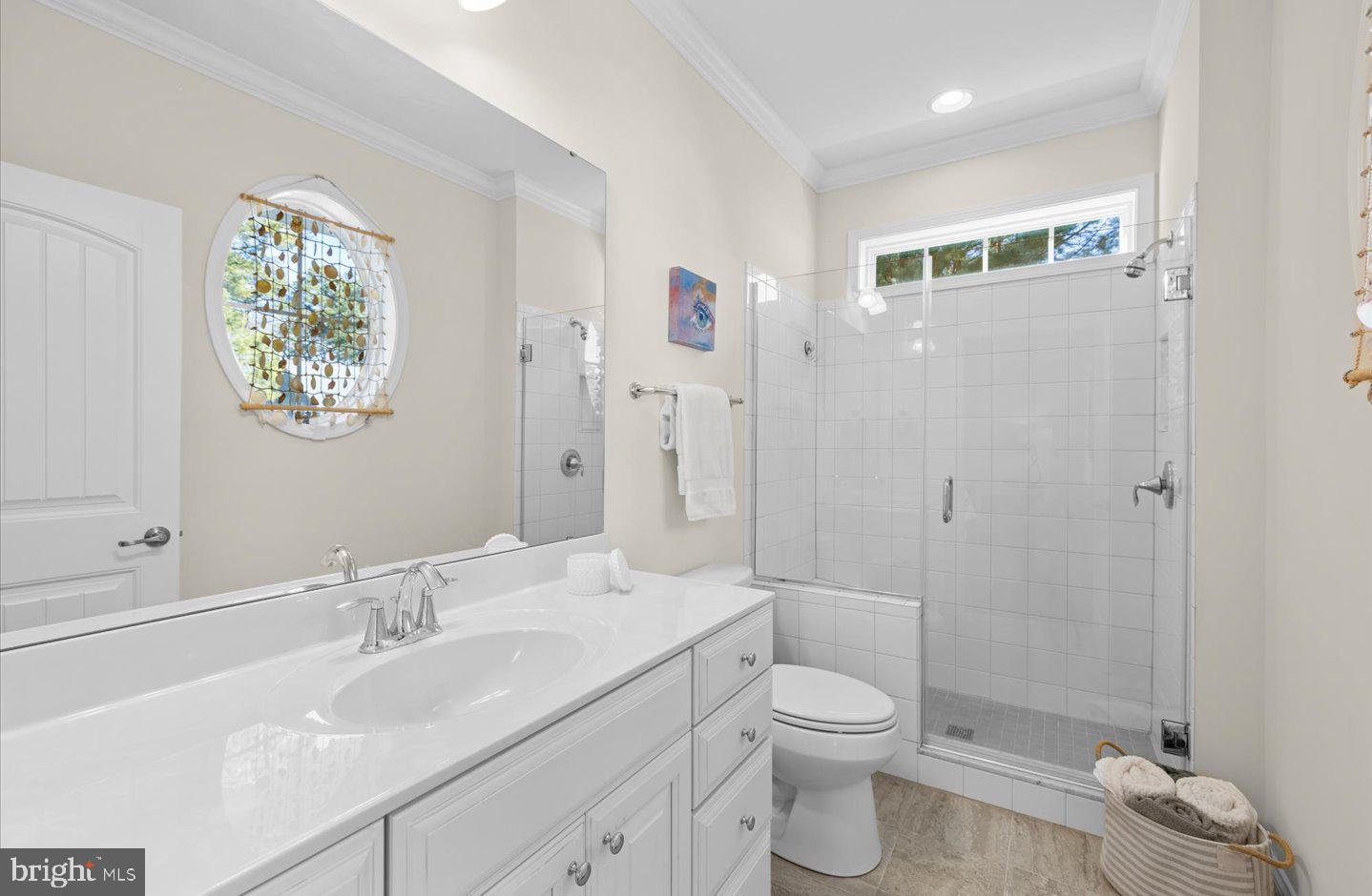 23280 Horse Island Road Lewes, DE 19958 - Photo 26 of 71 a bathroom with a granite countertop sink a toilet and shower