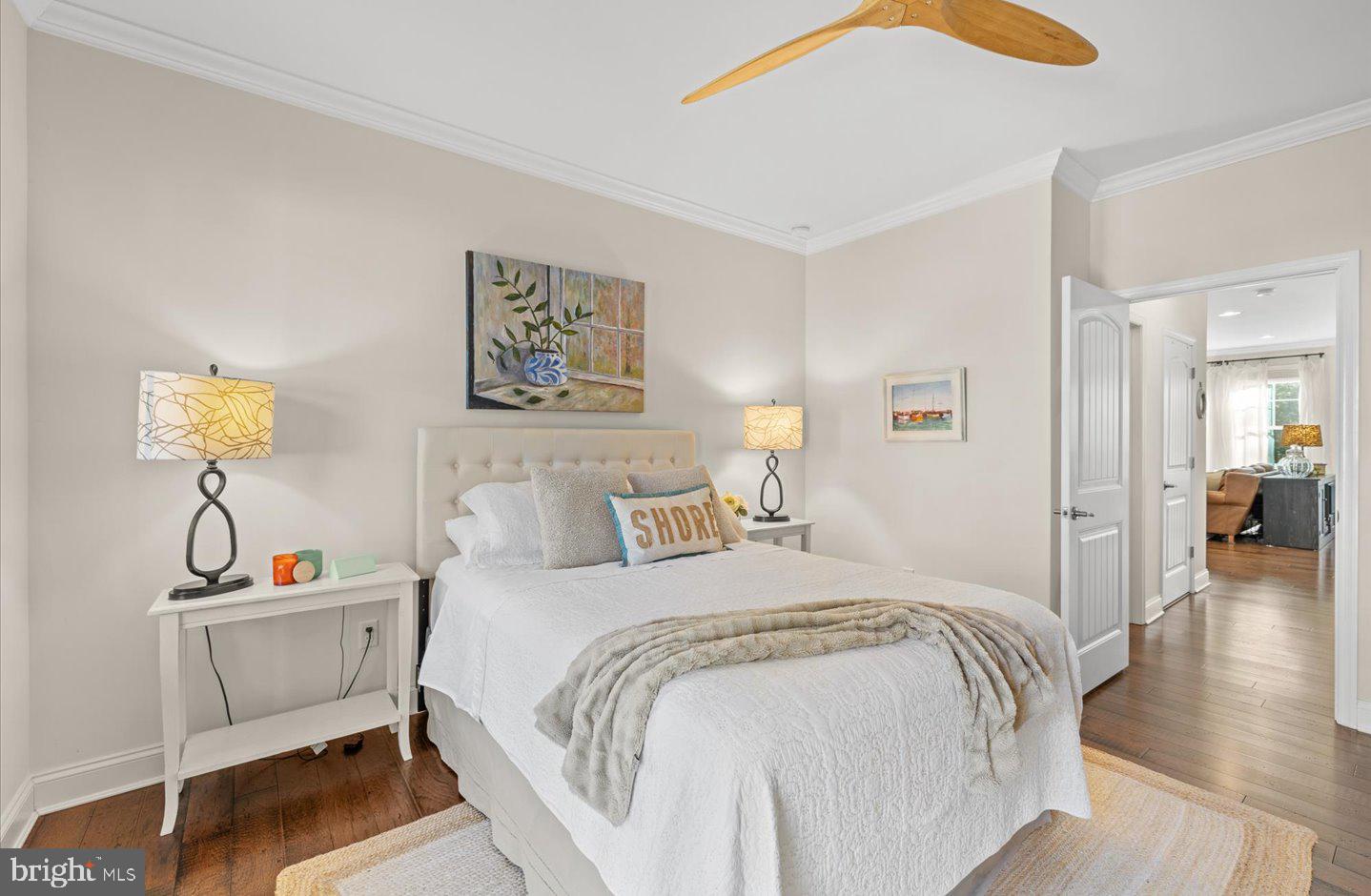 23280 Horse Island Road Lewes, DE 19958 - Photo 27 of 71 a bedroom with a bed and a table in it