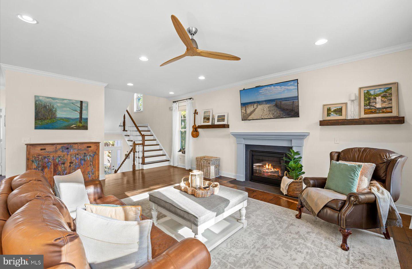 23280 Horse Island Road Lewes, DE 19958 - Photo 28 of 71 a living room with furniture and a fireplace