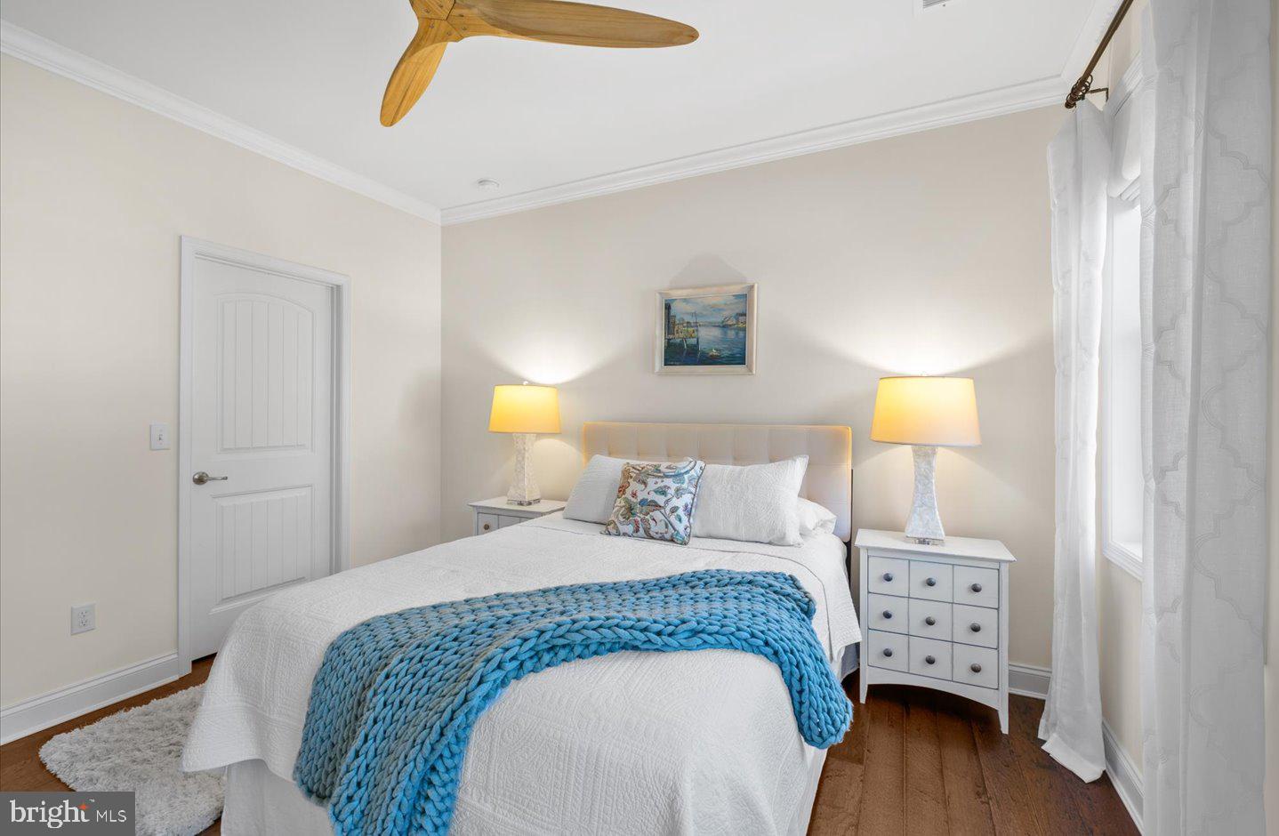 23280 Horse Island Road Lewes, DE 19958 - Photo 33 of 71 a bedroom with a bed and a lamp