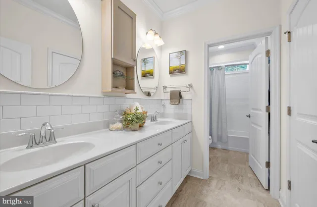a bathroom with a bathtub and shower