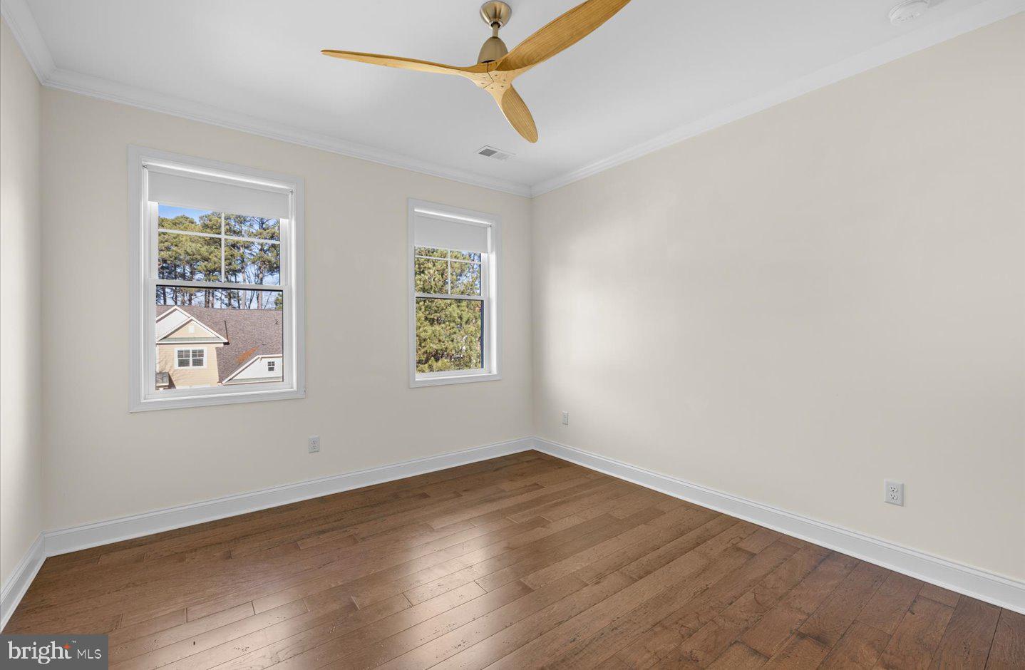23280 Horse Island Road Lewes, DE 19958 - Photo 36 of 71 an empty room with windows and fan