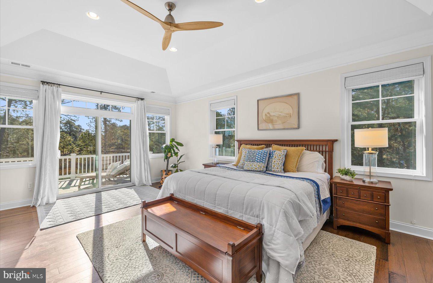 23280 Horse Island Road Lewes, DE 19958 - Photo 37 of 71 a bedroom with a large bed and a large window