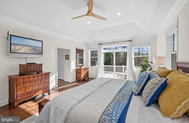 a view of a porch with furniture and garden