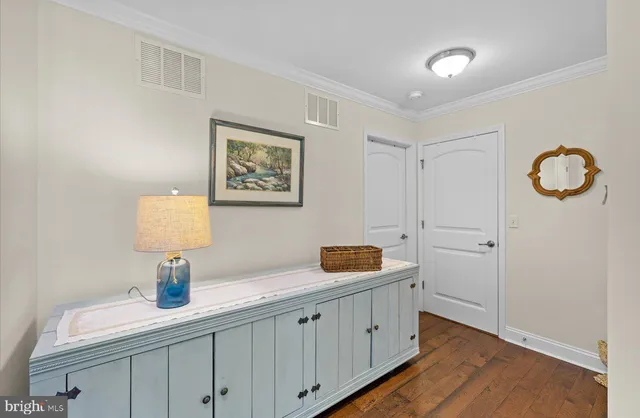 a room with gym equipment and windows