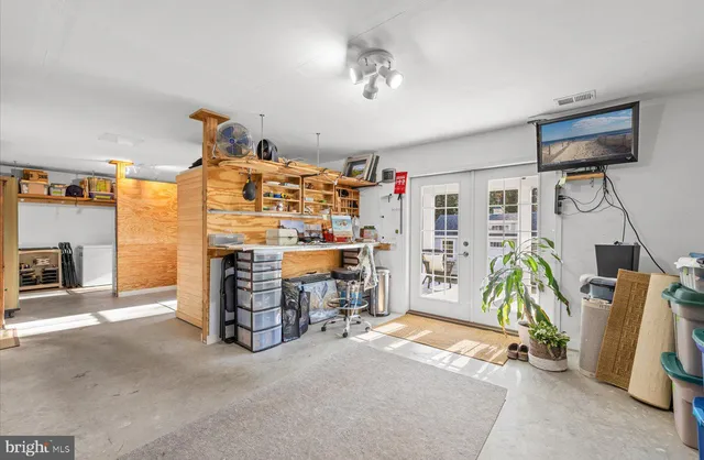 a wooden bench sitting in the middle of a lake
