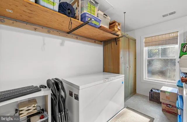 a view of a balcony with an outdoor space and seating area