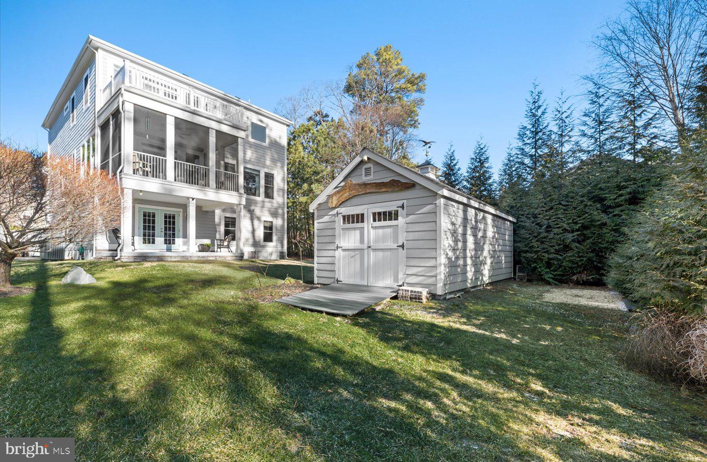 23280 Horse Island Road Lewes, DE 19958 - Photo 54 of 71 a view of a house with a yard