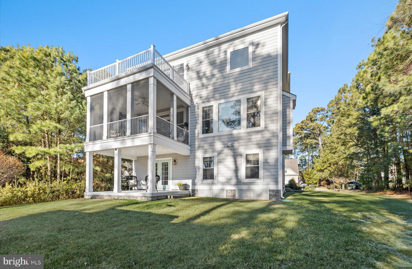 23280 Horse Island Road Lewes, DE 19958 - Photo 55 of 71 front view of a building with a yard