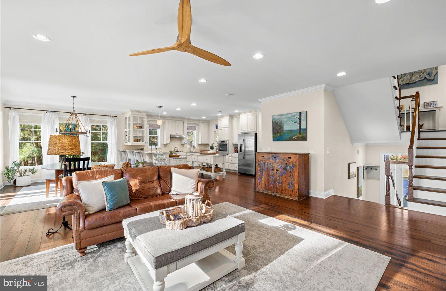 23280 Horse Island Road Lewes, DE 19958 - Photo 7 of 71 a living room with furniture kitchen view and a wooden floor