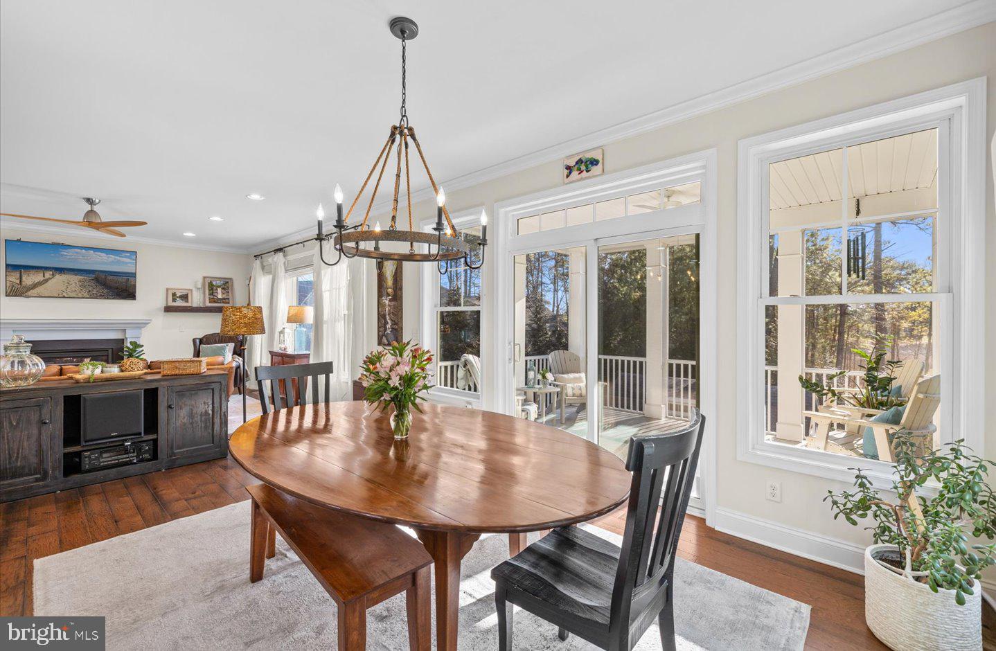 23280 Horse Island Road Lewes, DE 19958 - Photo 10 of 71 a view of a dining room with furniture window and wooden floor