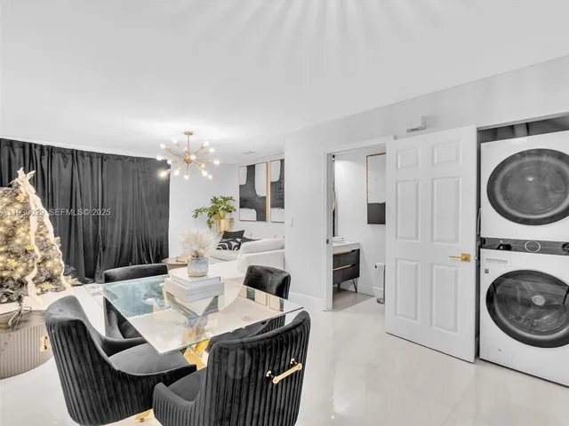 a view of a kitchen with dining table and chairs