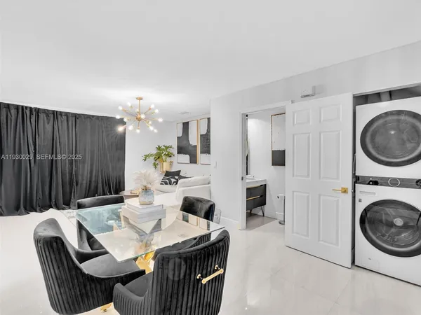 a view of a hallway with entryway wooden floor and front door