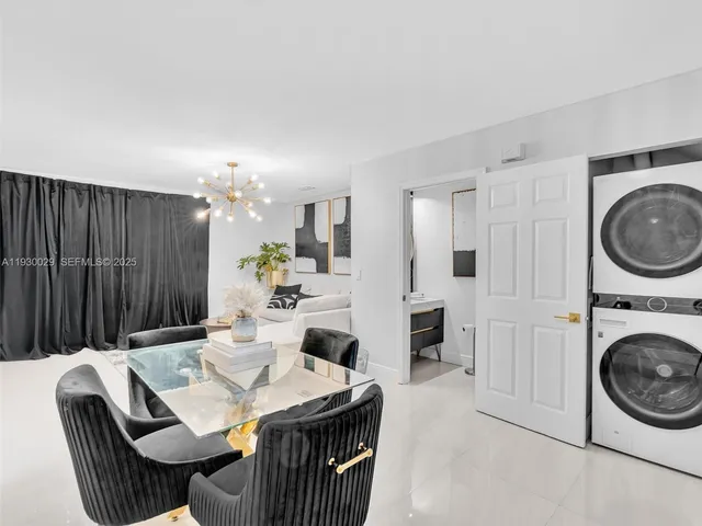 a view of a hallway with entryway wooden floor and front door