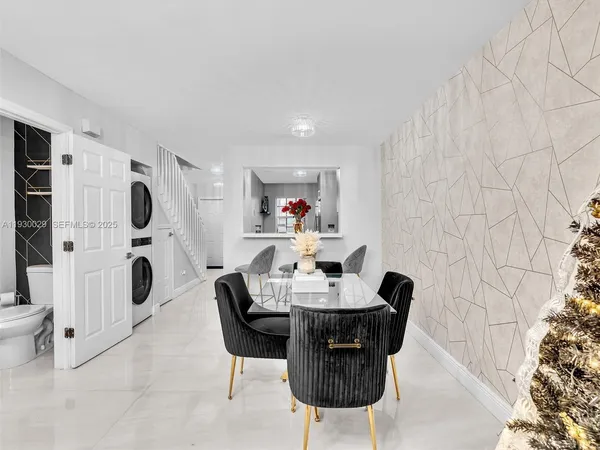 a dining room with furniture and a fireplace