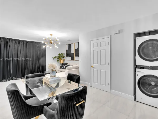 a kitchen with a table chairs and a stove