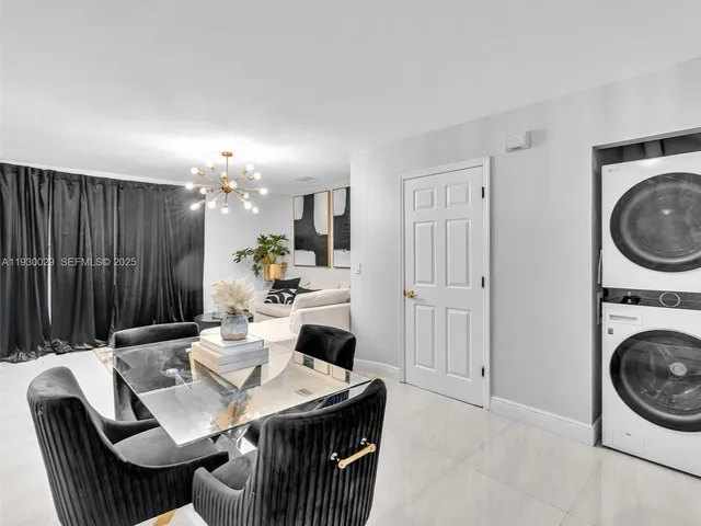 a kitchen with a table chairs and a stove