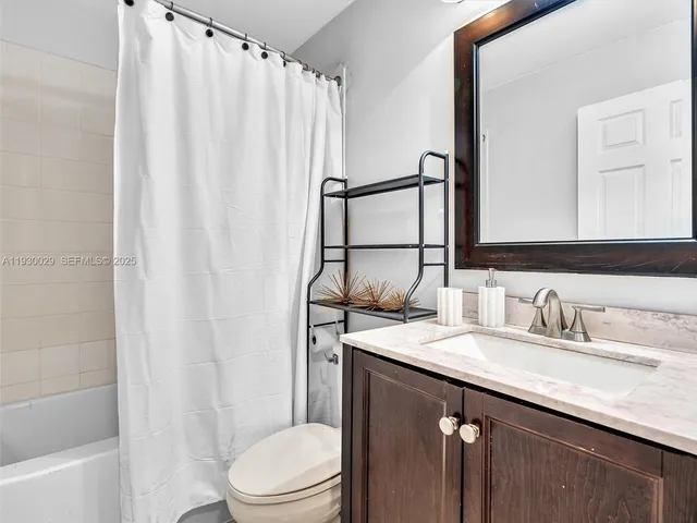 a view of a swimming pool with a yard