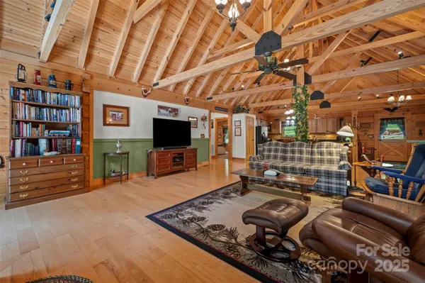 a room with lots of furniture and a flat screen tv