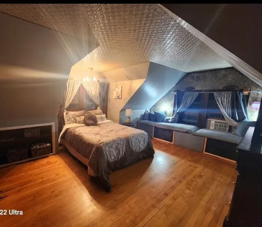 a bed room with a bed and a night stand