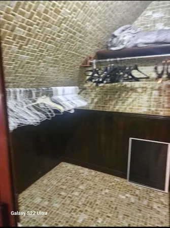 a bathroom with a sink a large mirror and a shower