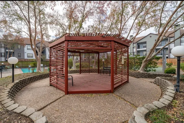 a view of a chair and table in the patio