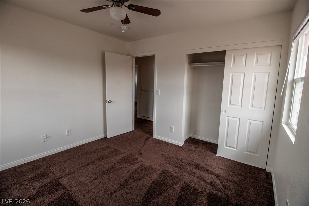 119 West Victory Road Henderson, NV 89015 - Photo 23 of 26 A comfortable bedroom with rich brown carpeting awaits your personal touch.
