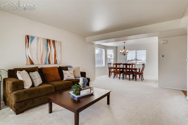 461 Talus Road Monument, CO 80132 - Photo 5 of 40 Welcoming front room and dining room!