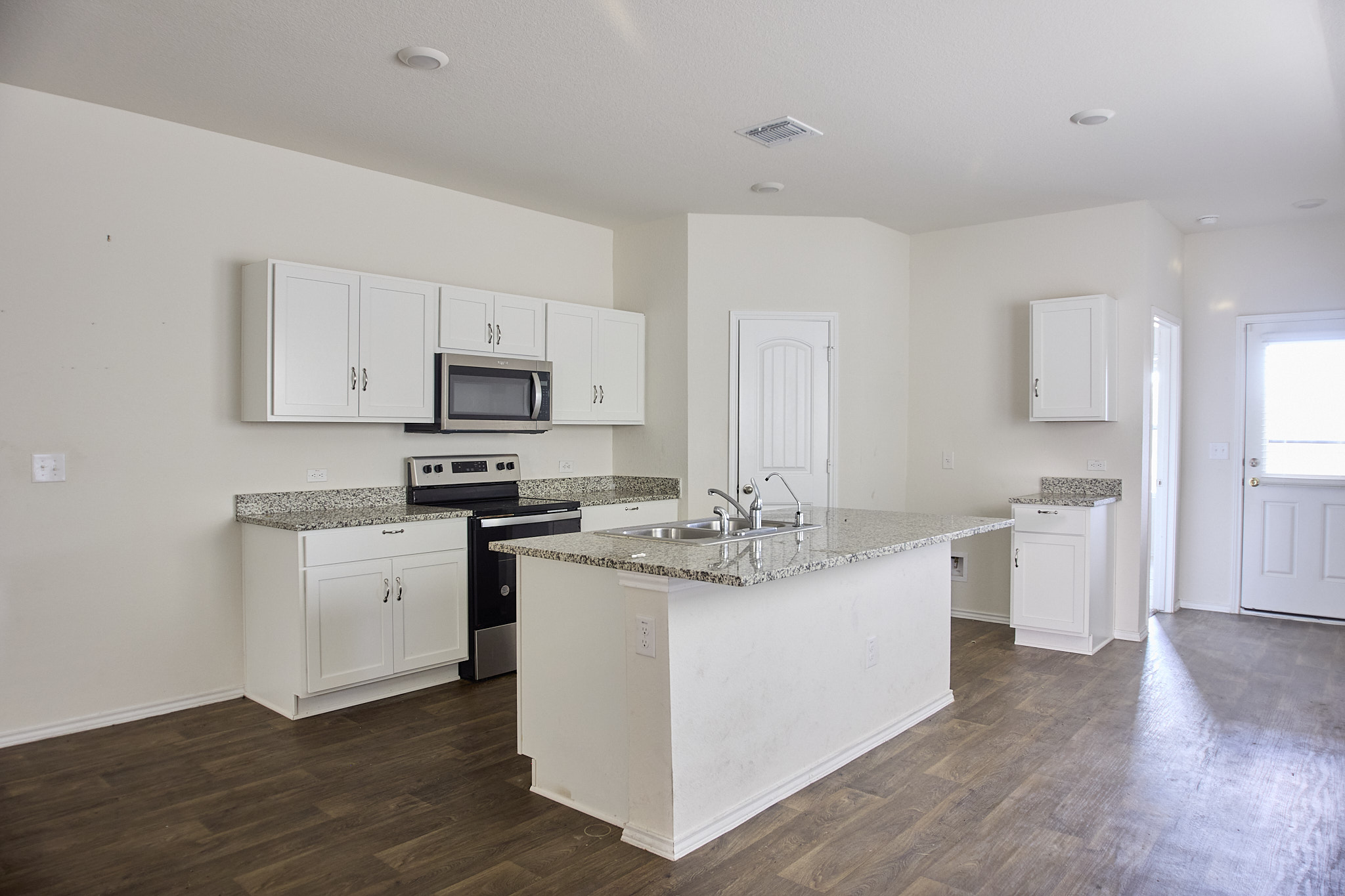 12008 Roving Pass Elgin, TX 78621 - Photo 8 of 20 A Welcoming Island for those easy going meals or extra prep space.