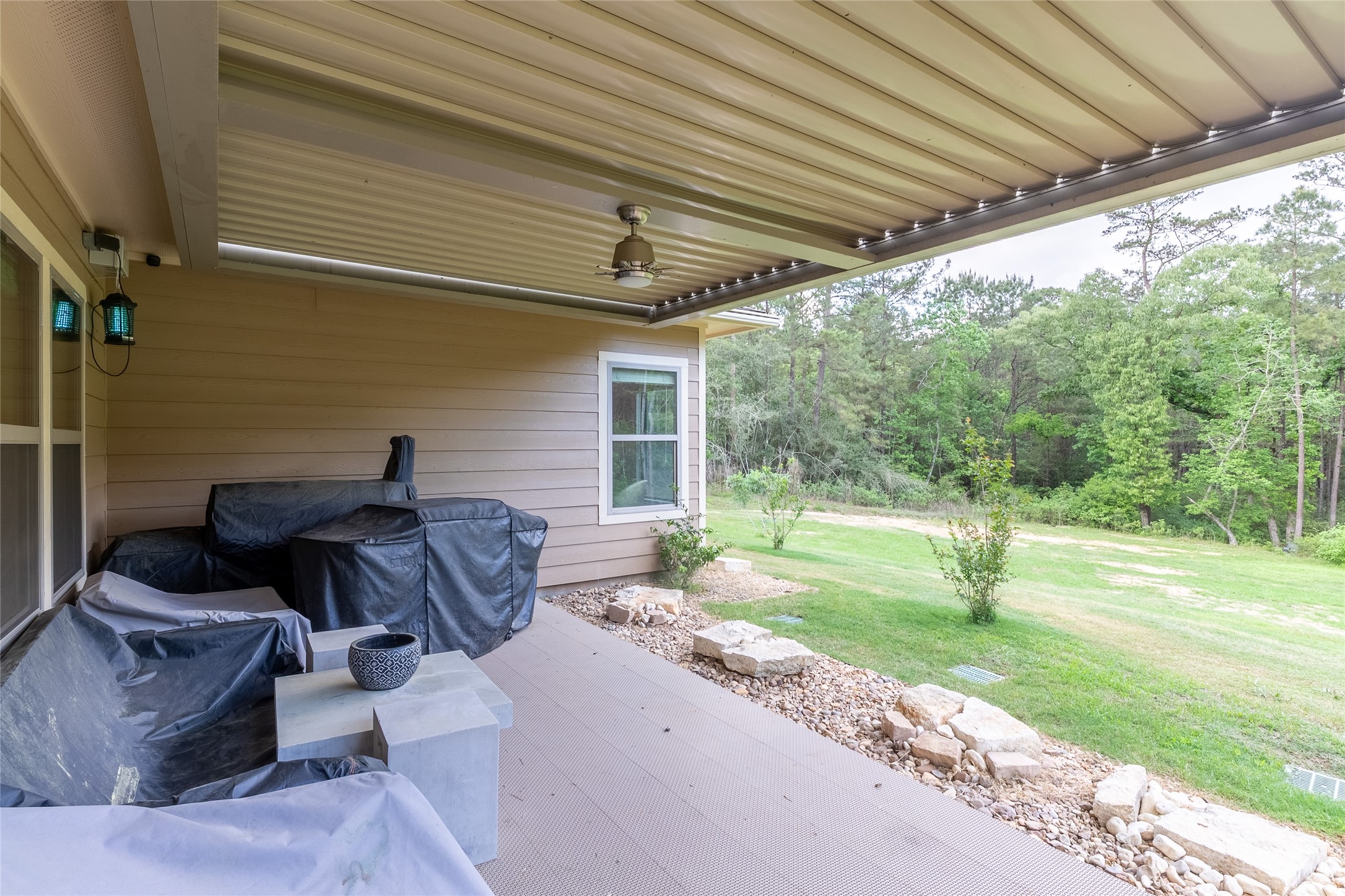 120 Sanctuary Road Huntsville, TX 77340 - Photo 31 of 38 a house view with a sitting space and garden space