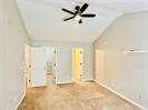 a view of empty room with ceiling fan