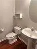 a bathroom with a toilet and a sink