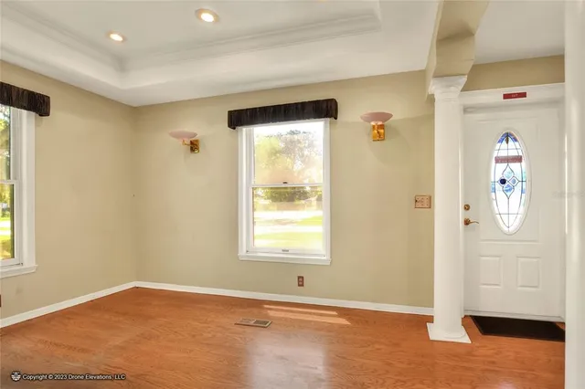 a view of entryway with wooden floor and stairs