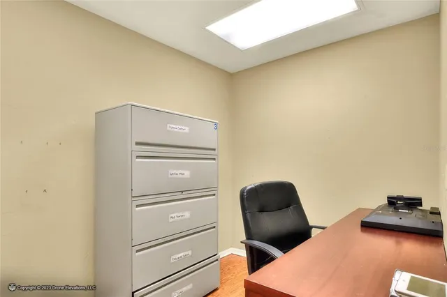 a bathroom with a toilet a sink and a mirror
