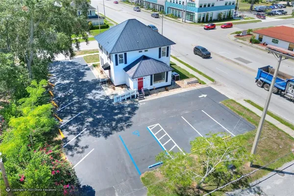 a view of a hallway with wooden floor and closet area