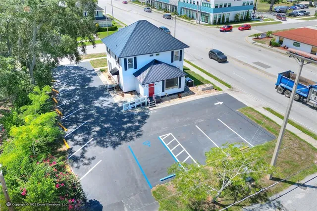a view of a hallway with wooden floor and closet area