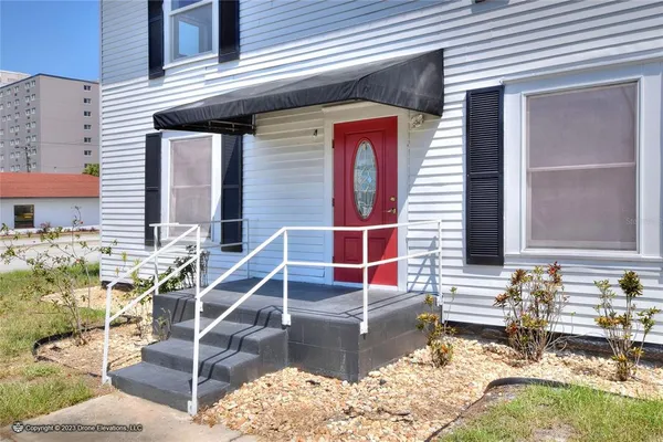 a view of a big room with windows and closet
